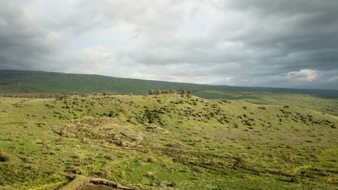 Sunny day and cloudy sky over green hill, aerial footage Stock Footage 88260562