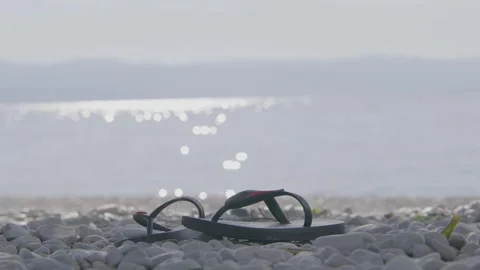 Sunny day at Istrian beach with flip flops Stock Footage 240444207