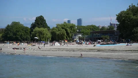 Sunny day at Kitsilano Beach - People enjoying Beach Video stock 206585853