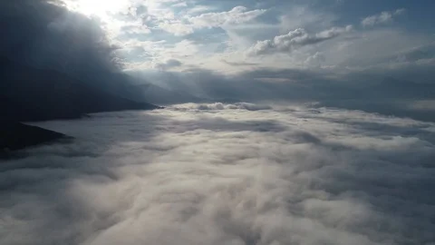 Sunny day in the mountains high in the sky above the clouds #2 (4k DJI MAVIK 2 P Stock Footage