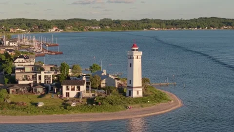 Sunny Day Orbit of Strib Lighthouse with the New Little Belt Bridge in the Stock Footage 346747217
