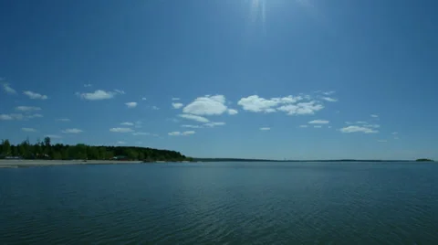 Sunny day on the sea, clouds move on the sky. Time lapse. Stock Footage 38420355