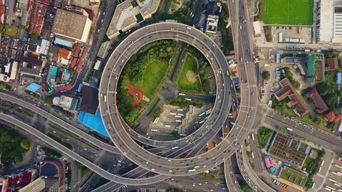 Sunny day shanghai city traffic round road junction aerial top view 4k china Stock Footage