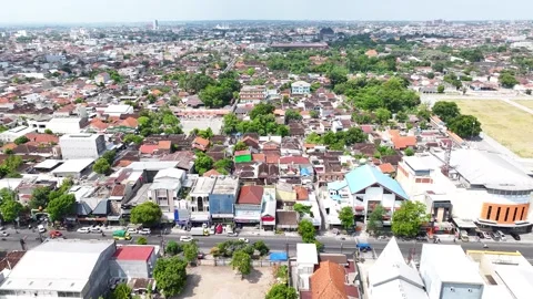 Sunny day In Surakarta, Central Java. Aerial view of the street and the Stock Footage 310283783