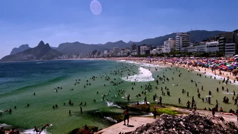 Sunny Daytime View of Arpoador Beach with Crowds and Leblon Skyline in Rio de 스톡 동영상 327528867