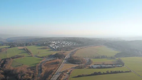 Sunny Drone flight over fields, cars, roads Stock Footage 103066995