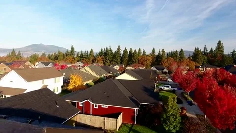 Sunny fall aerial flight over a neighborhood in North America. Fall suburbia 04 Stock Footage 69302846