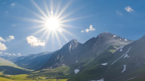 Sunny green mountain valley under a sparkle sun Stock Footage 339058192