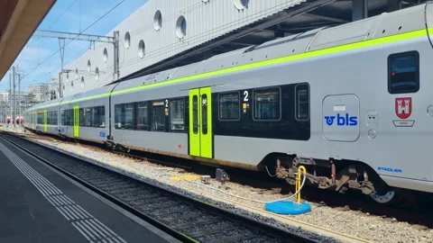 A sunny moment at Bern Central Station in Switzerland, where a regional train Stock Footage 344489293