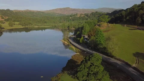 Sunny morning over mountain lake - Rydal Water, Lake District, United Kingdom Stock Footage