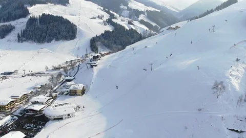 Sunny Mountain view Ski Resort in Austria Europe Camera Flying  over Cable Car Stock Footage 104231722