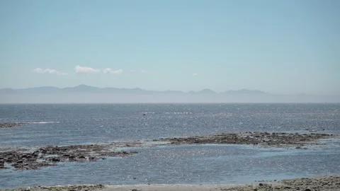 Sunny Ocean Light Waves Beach Mountains Stock Footage 233282745