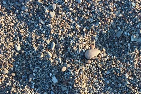 Sunny pebble texture Stock Photos