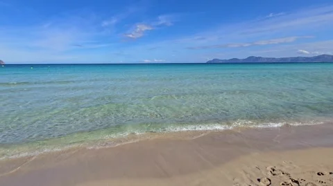 Sunny Playa de Muro beach with gentle turquoise waves in Mallorca Stock Footage 321048132