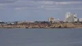 Sunny Praia da Rocha beach and hotel buildings skyline panning Portugal 4k or 4k+ Resolution