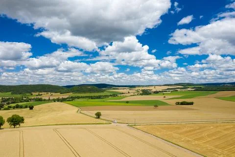 Sunny rural fields and patchwork countryside view 스톡 사진