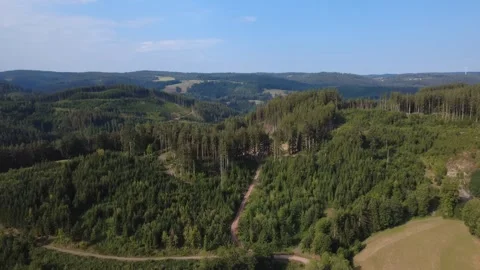 Sunny Rural Landscape with Fields, Roads and Green Hills from Above Stock Footage 340584797