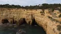 Sunny sand stone cliffs landscape at Algarve coastline Portugal 4k or 4k+ Resolution