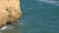Sunny sand stone cliffs zoom out at Algarve coastline Portugal 4k or 4k+ Resolution