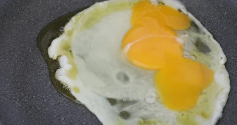 Sunny side egg cooking on hot frying pan Stock Footage 97203696