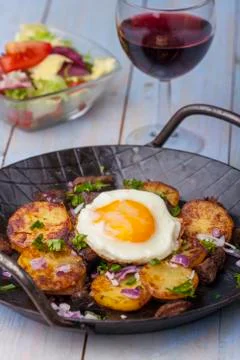 Sunny side up egg on groestl Stock Photos