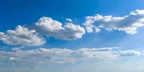 Sunny sky with cloudscape clouds. Blue sky contains cumulus clouds. Open sky  Stock Photos