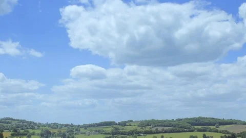 Sunny sky time-lapse. Summer in the green fields. Quickly moving clouds. Stock Footage 99059363