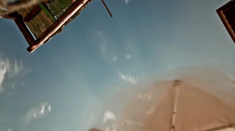 Sunny Sky view Under the Umbrella Time Lapse Stock Footage 31997154