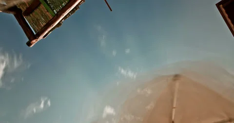 Sunny Sky view Under the Umbrella Time Lapse 4K Stock Footage 32008015