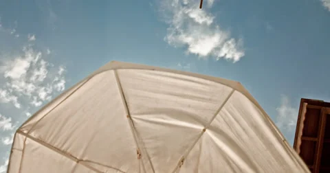 Sunny Sky view Under the Umbrella Time Lapse 4K Stock Footage 32010355