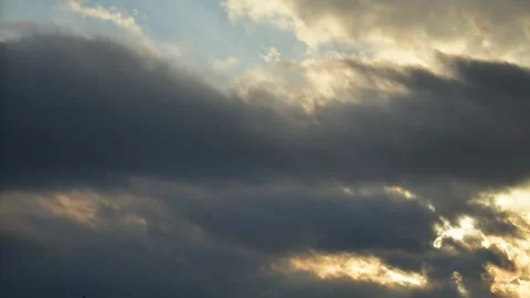 Sunny spells through forming clouds on evening sky time-lapse background.Cl.. Stock-Footage 242454019