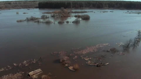 On a sunny spring day, the camera flies fast over a flooded area of the field Stock Footage 153910219