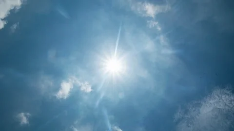 Sunny starburst effect on blue sky Time Lapse 4K Stock Footage 91146780