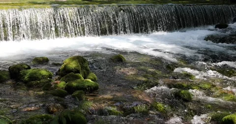 Sunny stream with magic waterfall Vídeos de archivo 231899938