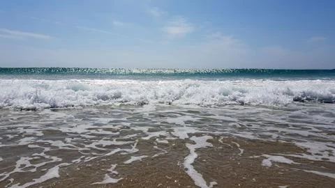 Sunny summer beach sea wave rush to shore Stock Photos