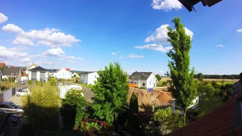 Sunny Summer Day Timelapse With Moving Clouds Constructionside And Sunset Stock Footage 70352162