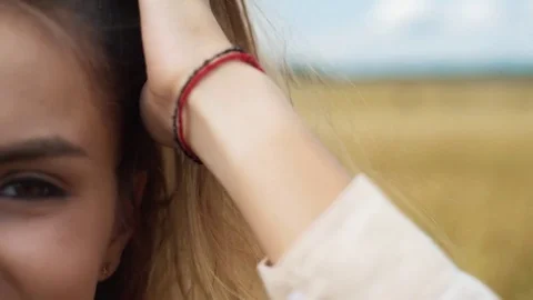 Sunny summer portrait of a beautiful smiling young woman 動画素材 79021053