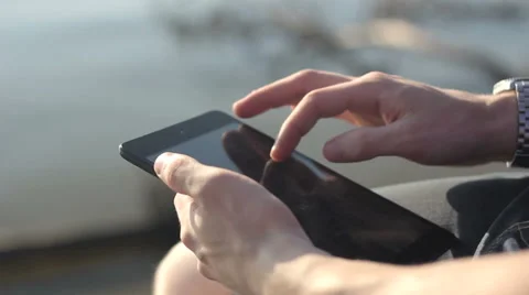 Sunny tablet in the hands of the guy on the nature 스톡 동영상 55335976