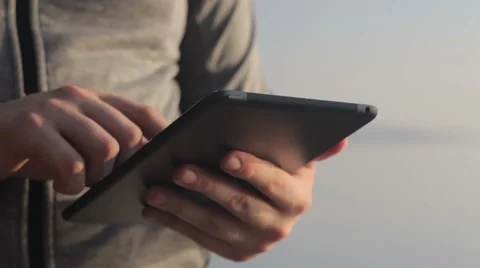 Sunny tablet in the hands of the guy on the nature 스톡 동영상 55336632