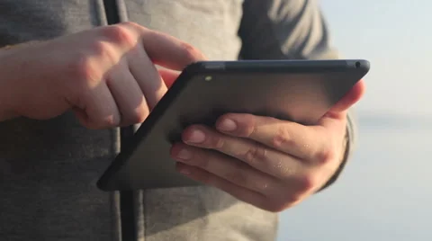 Sunny tablet in the hands of the guy on the nature 스톡 동영상 55336736