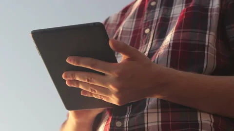 Sunny tablet in the hands of the guy on the nature 스톡 동영상 55337183