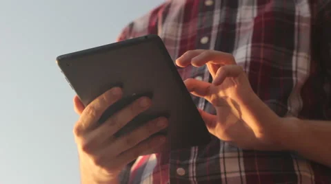 Sunny tablet in the hands of the guy on the nature 스톡 동영상 55337388