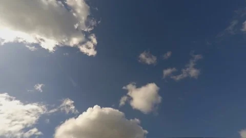 Sunny Timelapse of White Clouds and Airplane Stripes Stock Footage 79751013