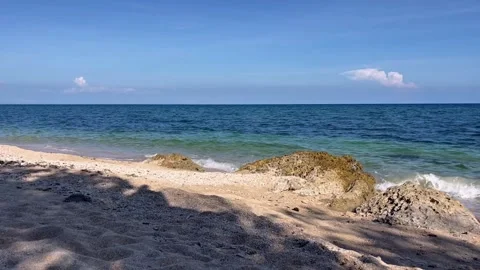 Sunny Tropical Beach Waves With Coastal Rocks Stock Footage 334986161