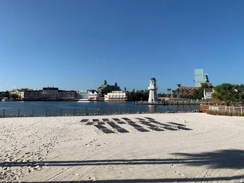 Sunny view of the beach with lighthouse Stock Photos