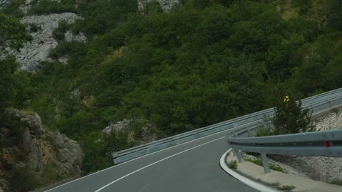 Sunny view of well-maintained serpentine road in Croatia Stock Footage 299895644