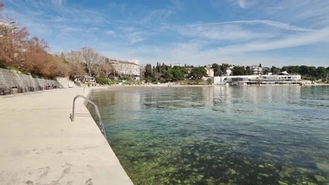 Sunny Winter Day at Split Bačvice Beach with People Relaxing Vidéo 331448986
