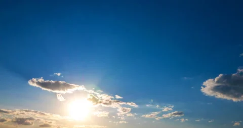 Sunray flying between cumulus clouds Stock Footage 138439920