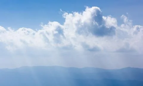 Sunray through haze on sky Stock Photos