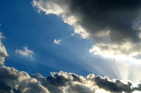 Sunrays across clouds, with blue space Stock Photos